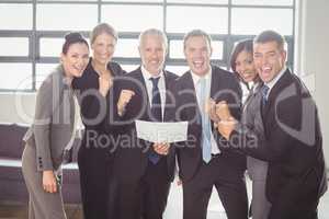 Team of businesspeople with certificate