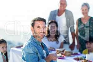 Happy family having a picnic at the beach