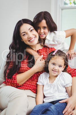 Portrait of smiling mother and daughters