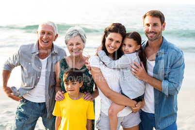 Happy family posing at the beach