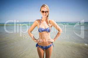 Portrait of happy woman standing on the beach