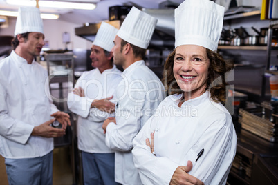 Portrait of smiling chef in commercial kitchen