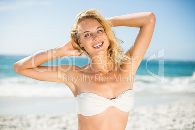 Smiling woman posing at the beach Smiling woman posing at the beach