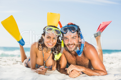 Couple wearing flippers at the beach