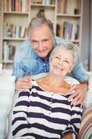 Portrait of senior couple in living room