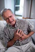 Senior man suffering from heart attack