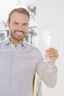 Man holding a glass of champagne