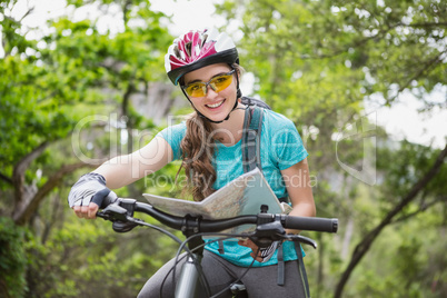 Smiling woman checking the map