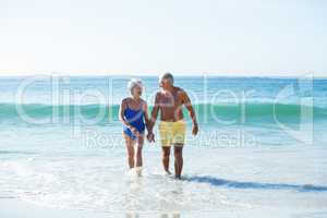 Senior couple walking on the water