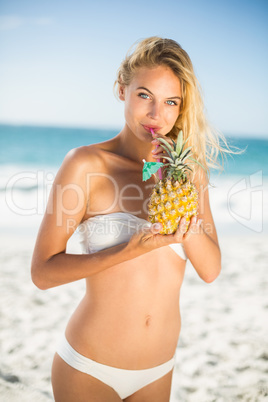Woman holding a pineapple