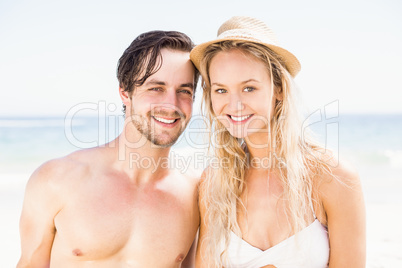 Portrait of young couple together on the beach