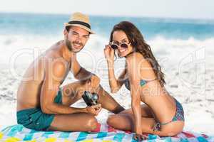 Cute couple sitting on the beach