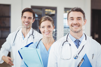 Portrait of cheerful docors standing in row