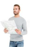 Young serious man holding a map