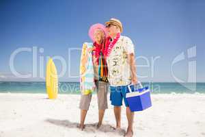 Senior couple holding icebox