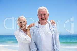 Senior couple embracing at the beach