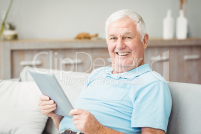 Portrait of senior man using digital tablet Portrait of senior man using digital tablet