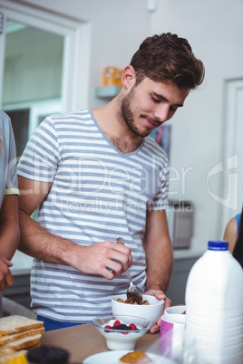 Smiling man preparing breakfast