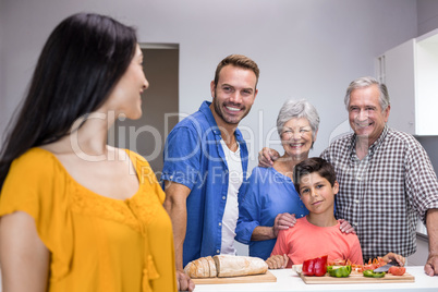 Happy family standing in the kitchen