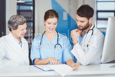 Doctor team working at computer desk