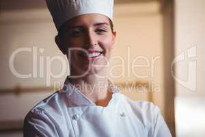 Chef smiling and posing with crossed arms