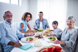 Happy family having breakfast together