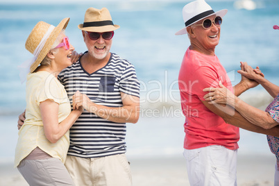 Senior couple dancing on the beach Senior couple dancing on the beach