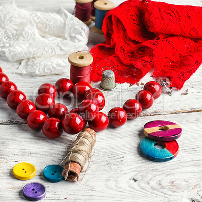Beads,thread and red cloth