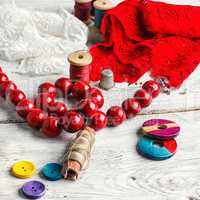 Beads,thread and red cloth