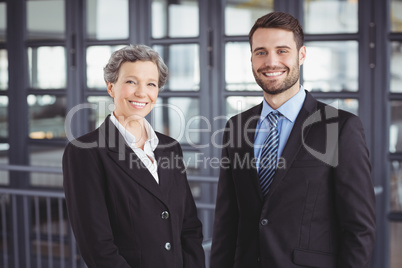 Happy business people standing in office