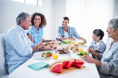 Happy family having breakfast together