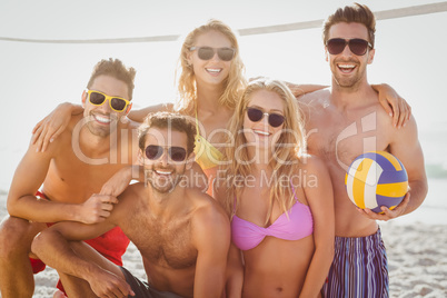 Friends playing beach volley