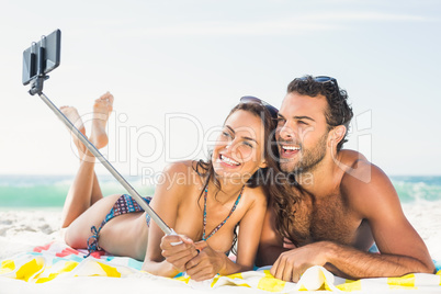 Couple taking selfie at the beach