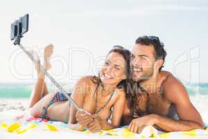 Couple taking selfie at the beach