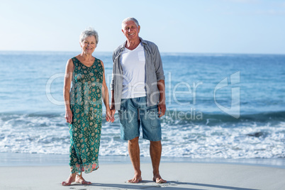 Senior couple holding hands