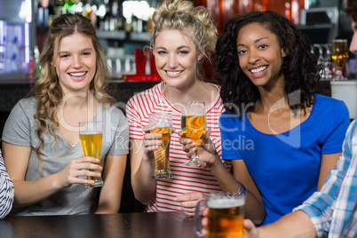 Happy friends having a drink