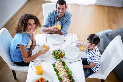 Portrait of family having breakfast together