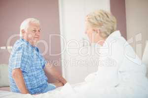 Angry senior couple in bedroom