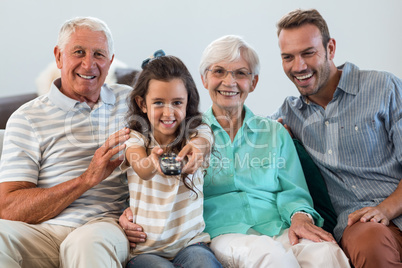 Happy family sitting on sofa