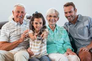 Happy family sitting on sofa