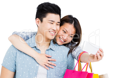 Happy young couple taking a selfie