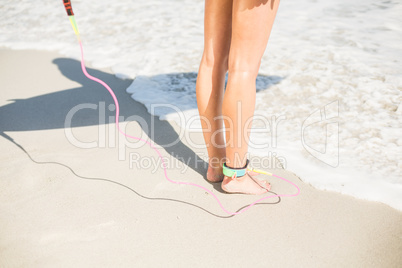 Surfers feet on the beach