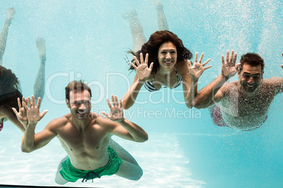 Cheerful friends swimming
