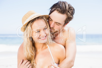 Young couple romancing on the beach