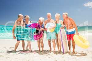 Senior friends with beach accessories