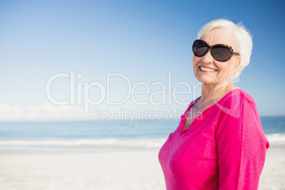 Happy senior woman with sunglasses smiling