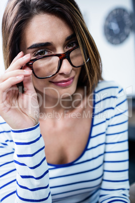 Portrait of confident young woman wearing eyeglasses