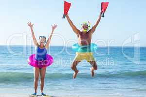 Senior couple with beach equipment