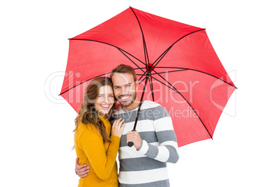 Happy young couple holding pink umbrella