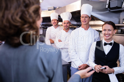 Restaurant manager briefing to his kitchen staff
